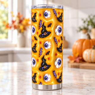 Eyeballs, witch hats and lightning on yellow — one tumbler in kitchen setting