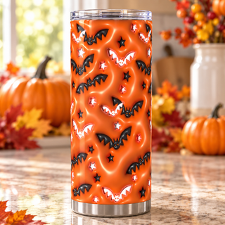 Black and white bats on orange — one tumbler in kitchen setting