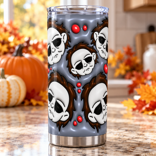 Pale-Masked Character face pattern on blue-gray — one tumbler in kitchen setting