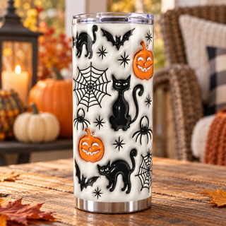 Black cats, jack-o-lanterns and webs on white — one tumbler in porch setting