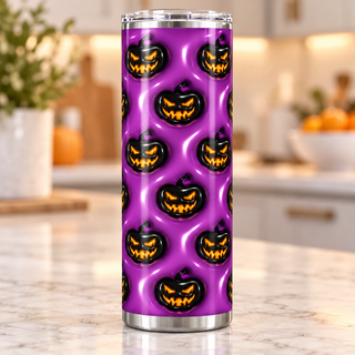 Black jack-o-lanterns on purple — single tumbler on a kitchen countertop