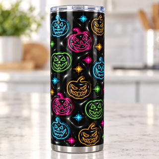 Multicolored outline jack-o-lanterns on black — single tumbler on a kitchen countertop