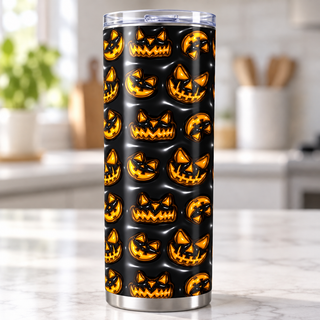 Orange jack-o-lantern faces on black — single tumbler on kitchen counter