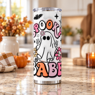 Spooky Babe: ghost, flowers and webs — one 20 oz skinny stainless steel tumbler in a kitchen lifestyle mockup