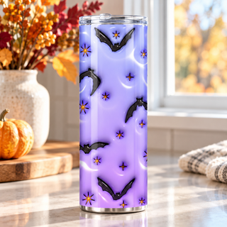 Illustrative lifestyle mockup of Bats, moons and flowers on lavender | Halloween Sublimation Tumbler. Finished item may vary slightly.