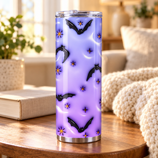 Illustrative lifestyle mockup of Bats, moons and flowers on lavender | Halloween Sublimation Tumbler. Finished item may vary slightly.