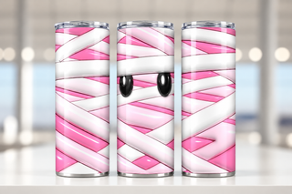 Pink mummy bandages and eyes — three views of one stainless steel tumbler