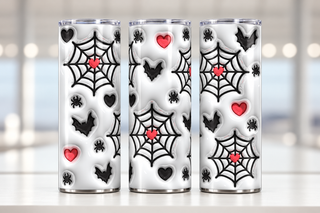 Spiderwebs, bats and hearts — three views of one stainless steel tumbler