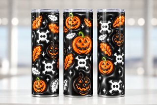 Jack-o-lanterns, skulls and autumn leaves on black — three views of one stainless steel tumbler